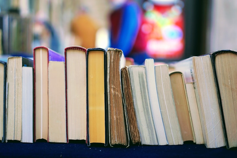 An open book lying on a wooden surface with pages spread