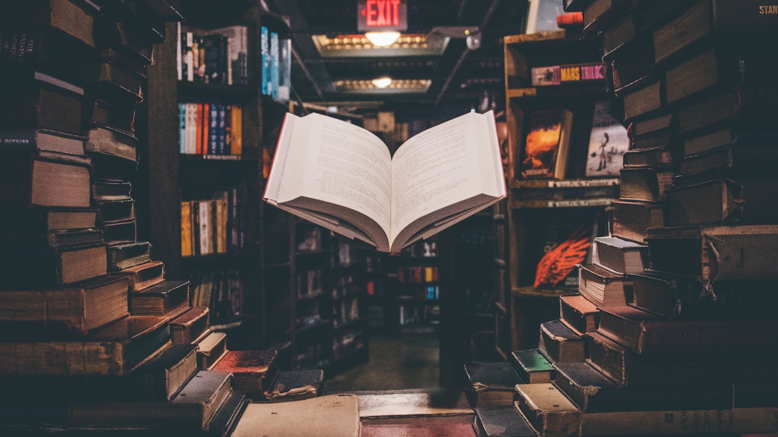 Close-up of fingers turning the page of an open book