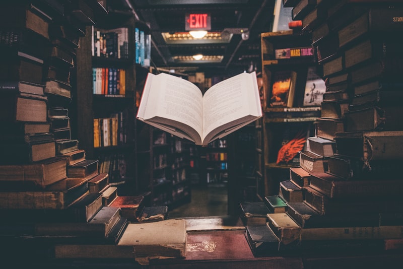 Close-up of fingers turning the page of an open book